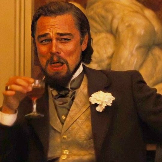Leonardo DiCaprio laughing while drinking meme template from django unchained